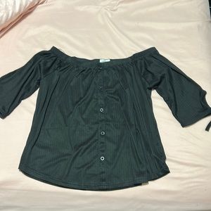Black cotton blouse. 3/4 arm length. Decorative button front.